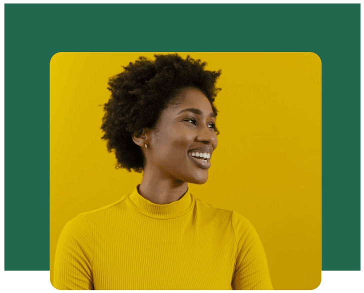 Confident and vibrant, a smiling woman in a yellow turtleneck embodies creativity and bold marketing strategies.
